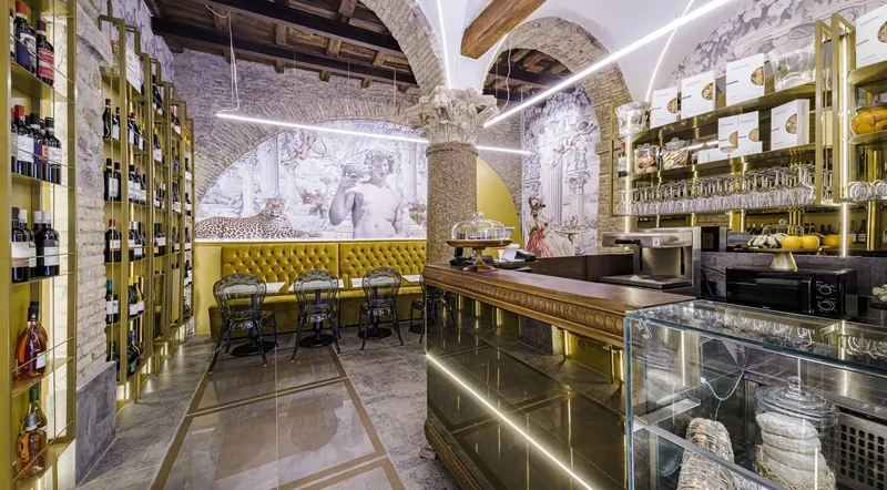 The arched, wine-lined interior of Maison Arlu restaurant near the Vatican