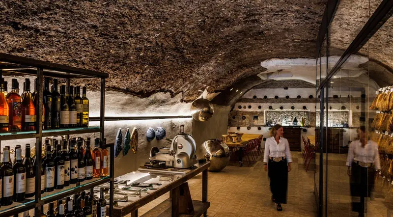 The long underground cave beneath Monte dei Cocci in Testaccio, lined with wine and cheese